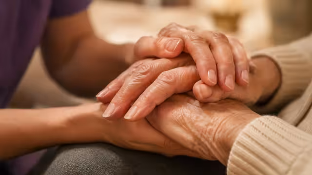 A care professional offering warm, reassuring support